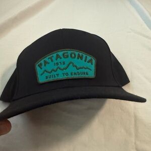Patagonia Black Hat with Teal Patch
Roger that - built to endure snap back